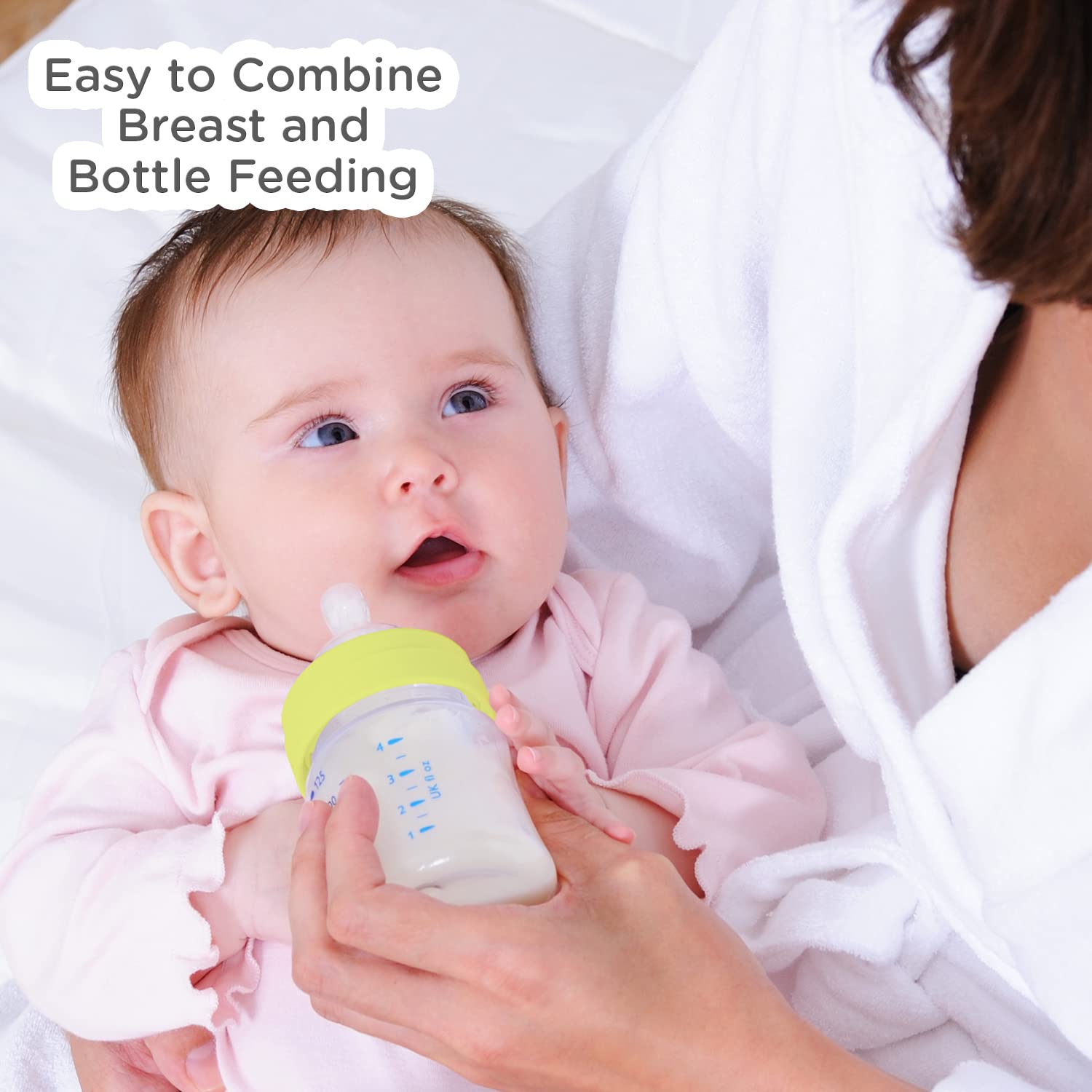 Mother feeding a baby with the Mee Mee borosilicate glass bottle