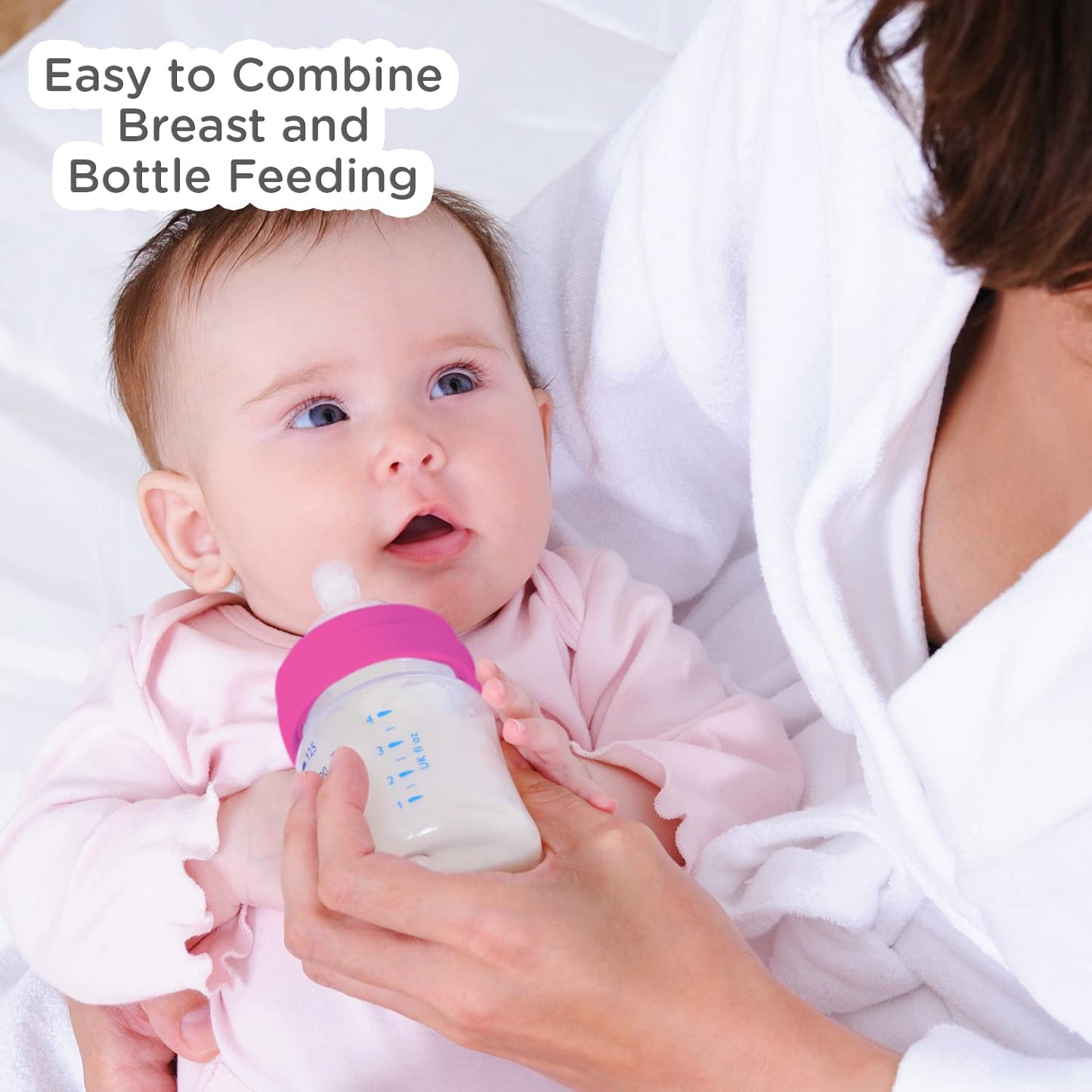 Mother feeding a baby with a Mee Mee Milk-Safe anti-colic bottle