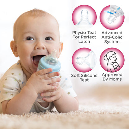 Baby holding a Mee Mee Milk-Safe bottle with advanced anti-colic system