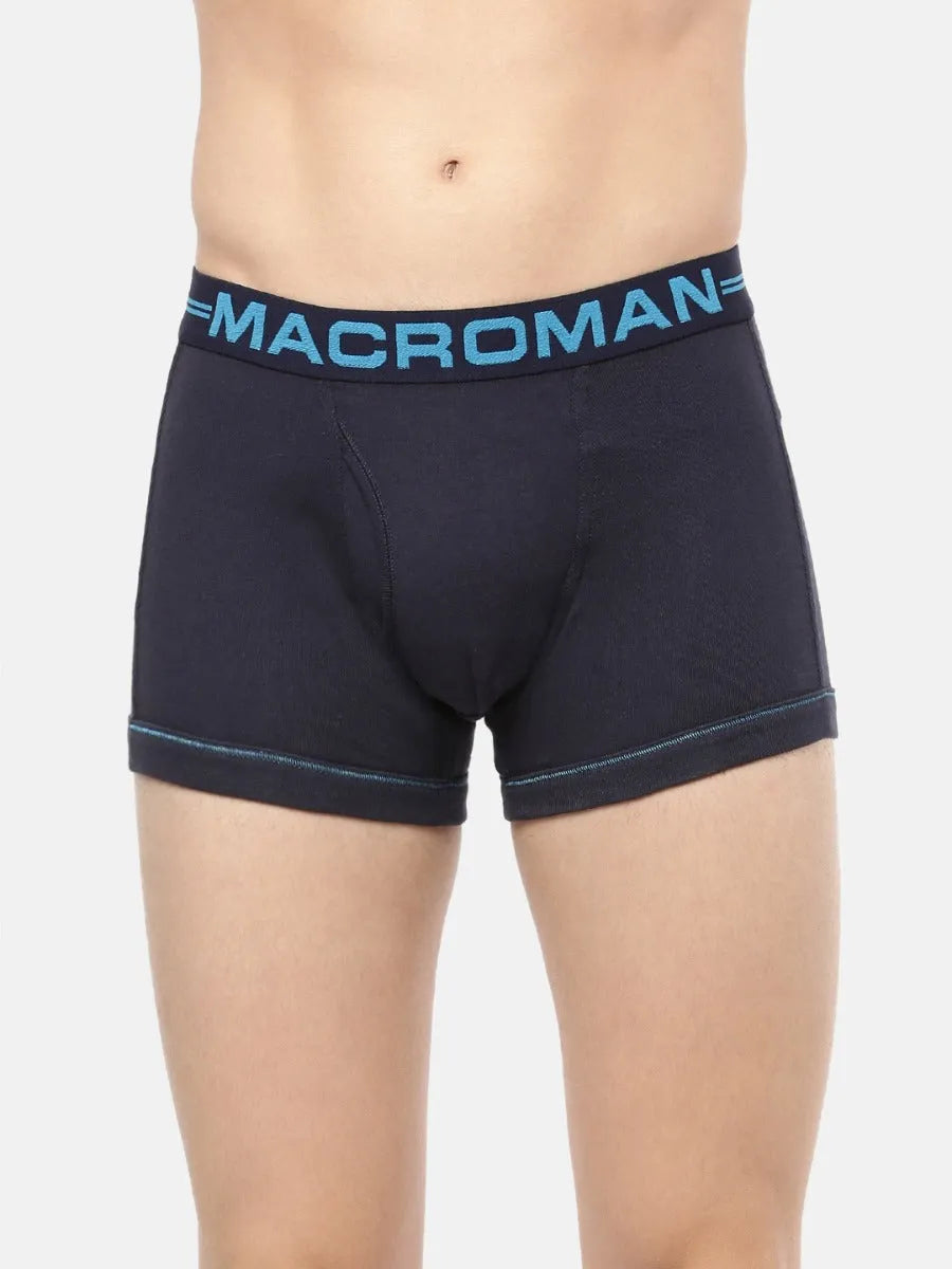 Close-up of the Macroman logo waistband on a navy cotton trunk