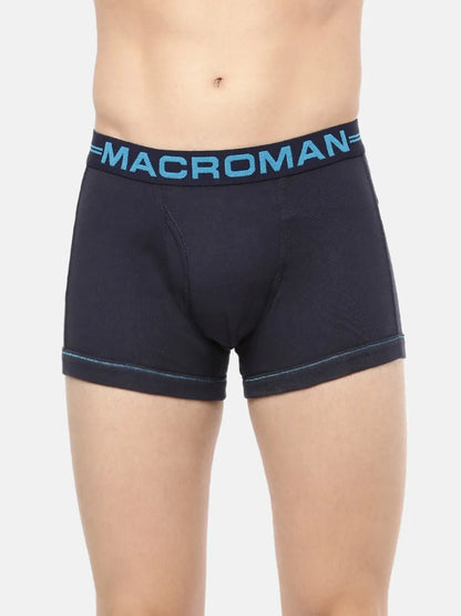 Close-up of the Macroman logo waistband on a navy cotton trunk