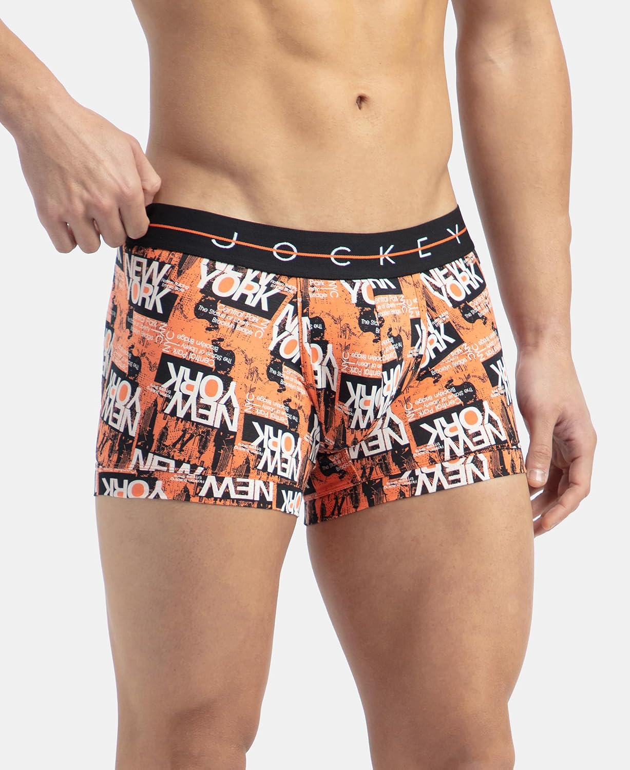 Jockey printed stretch trunk in orange graffiti print, angled view on model