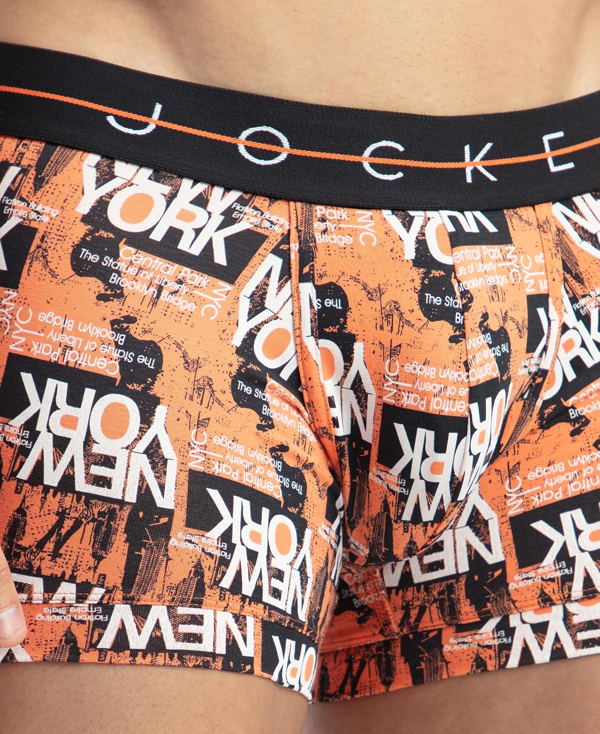Close-up of the Jockey waistband on an orange New York print stretch trunk