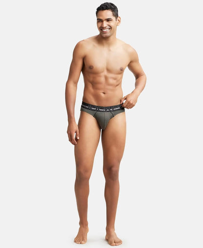 Full-length view of a model wearing Jockey olive cotton rib briefs