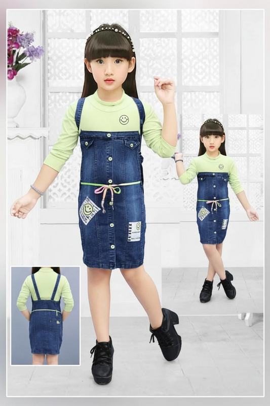 Girl in a green knit top with denim bodice middy dress by Mini Betti