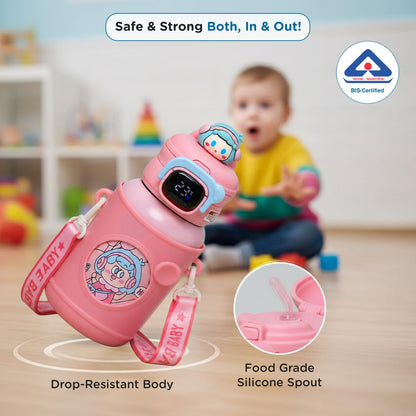 Toddler playing beside the pink Mee Mee Zippy insulated sipper cup